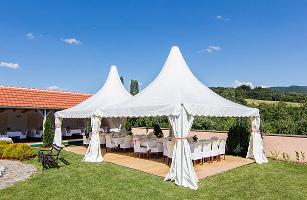 Outside wedding venue with marquee tent.